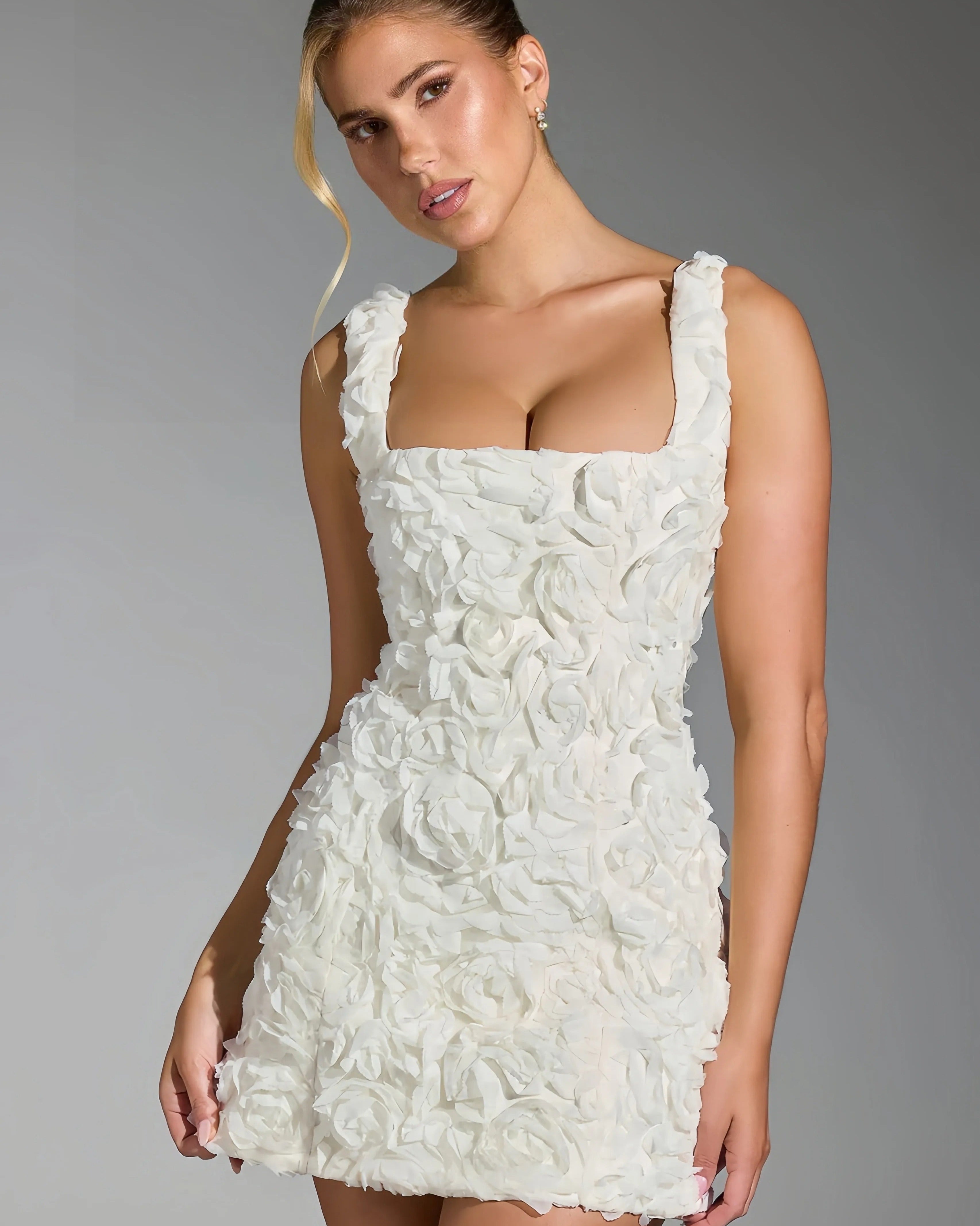 Rosy | Mini dress with 3D floral pattern 