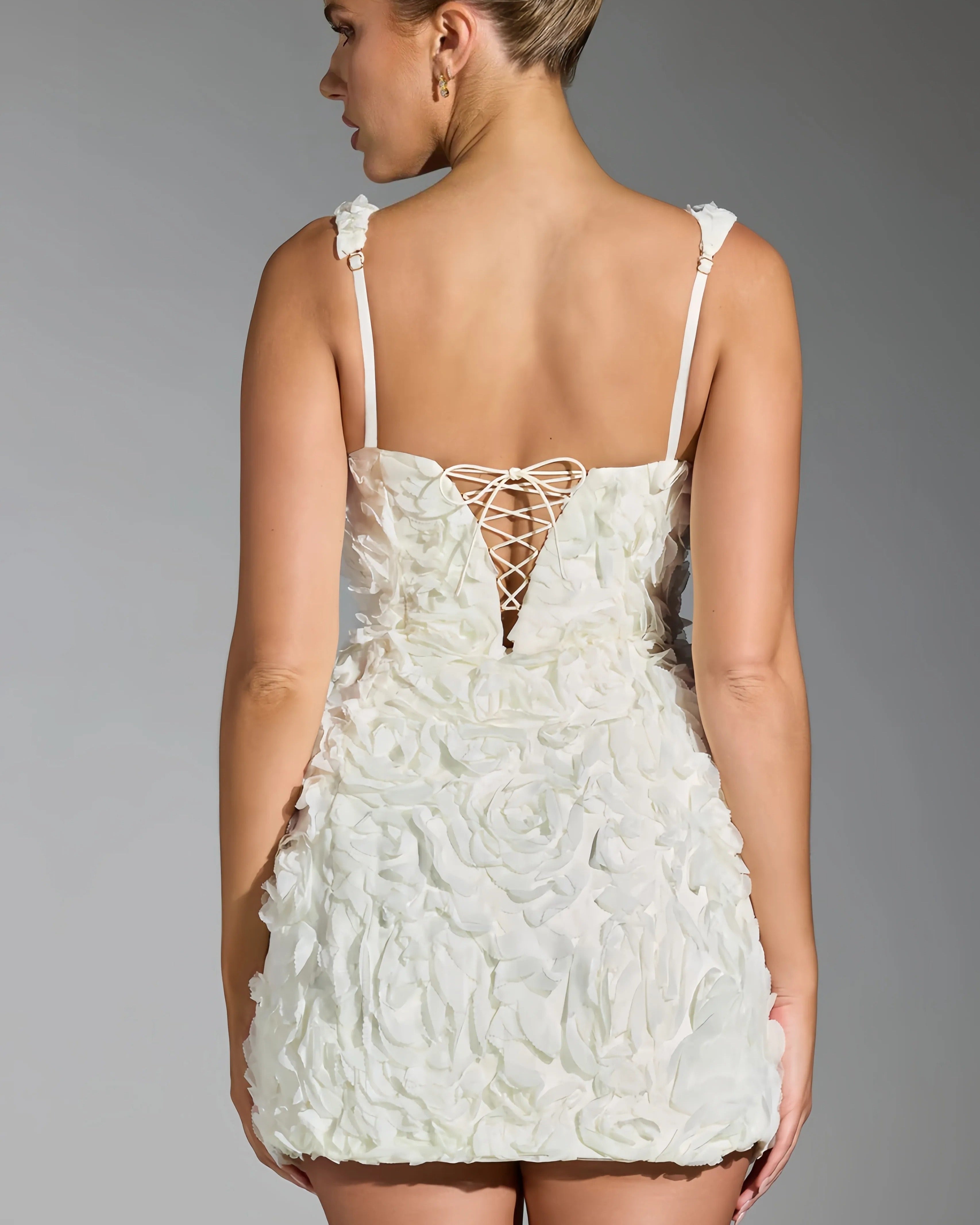 Rosy | Mini dress with 3D floral pattern 
